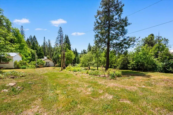 a view of outdoor space with deck and yard