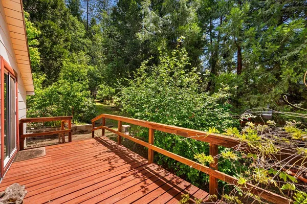 a view of a porch with furniture and garden