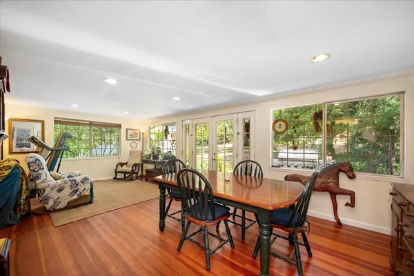 a view of a dining room with furniture window and outside view