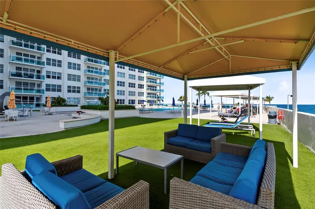 a view of a swimming pool with a patio