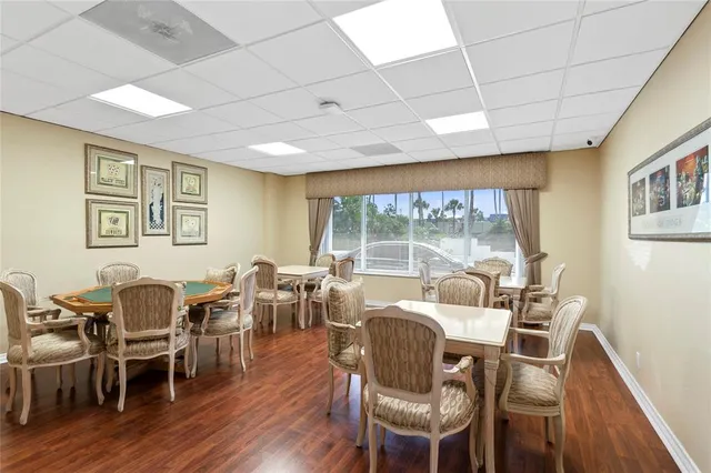 a workspace with furniture and a large window