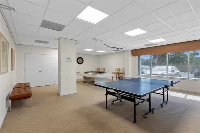 a view of a room with furniture and wooden floor