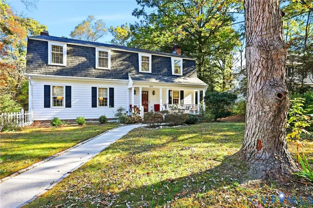 a front view of house with yard and swimming pool