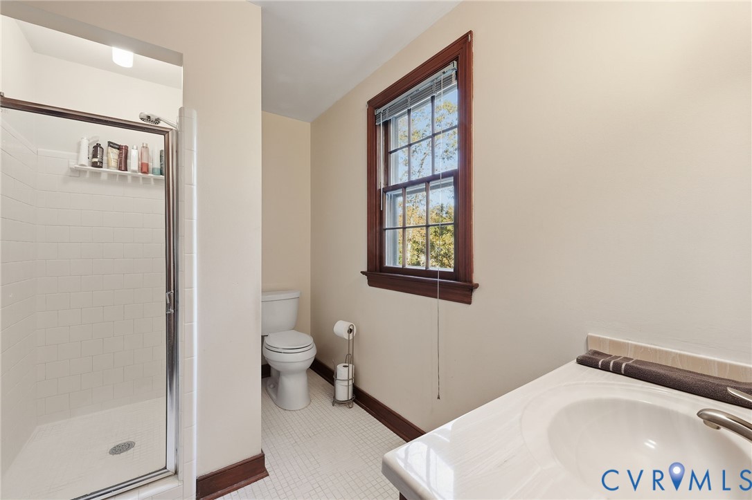 8216 Chainmaile Road North Chesterfield, VA 23235 - Photo 21 of 36 a bathroom with a toilet and a window