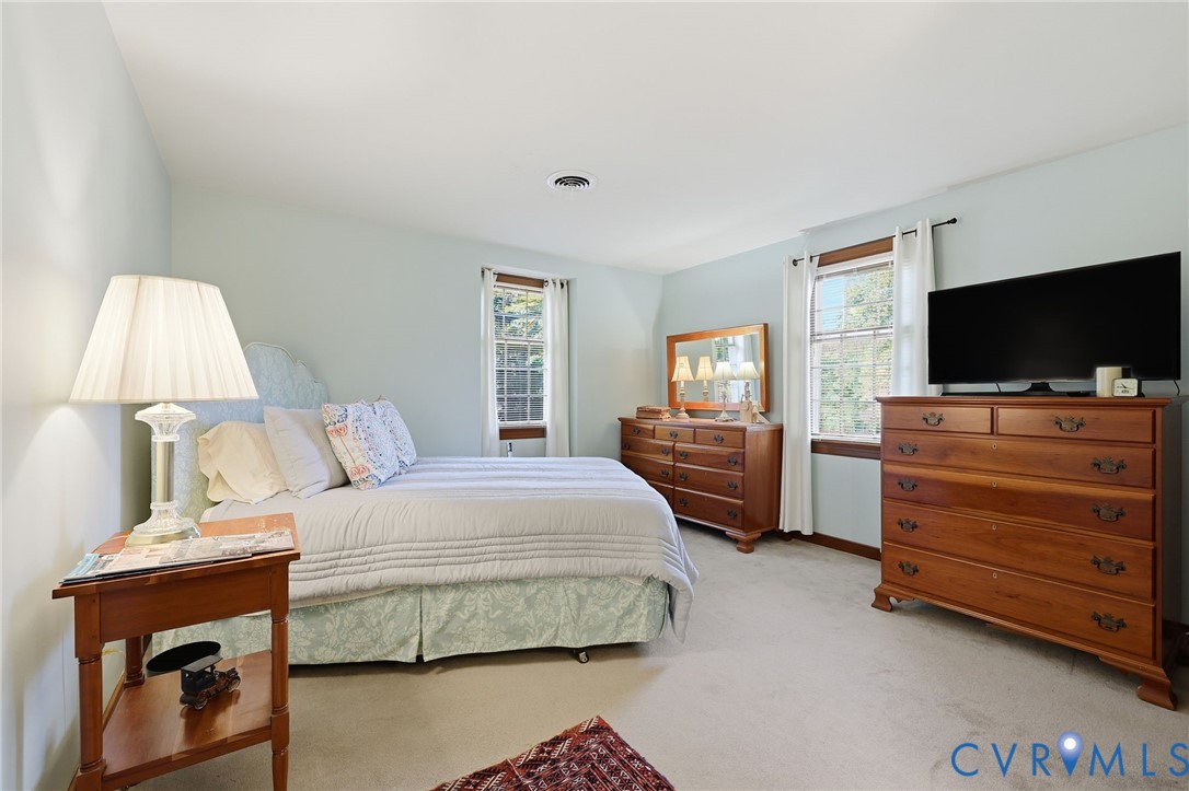 8216 Chainmaile Road North Chesterfield, VA 23235 - Photo 24 of 36 a bedroom with a bed and a flat screen tv