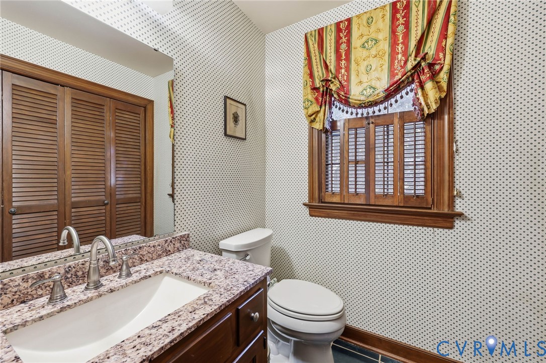 8216 Chainmaile Road North Chesterfield, VA 23235 - Photo 29 of 36 a bathroom with a granite countertop toilet and a sink
