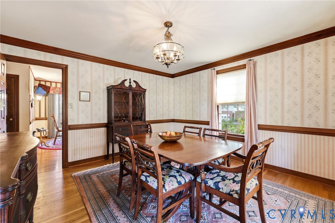 8216 Chainmaile Road North Chesterfield, VA 23235 - Photo 8 of 36 a view of a dining room with furniture window and wooden floor