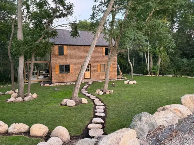 a kitchen with sink and white cabinets
