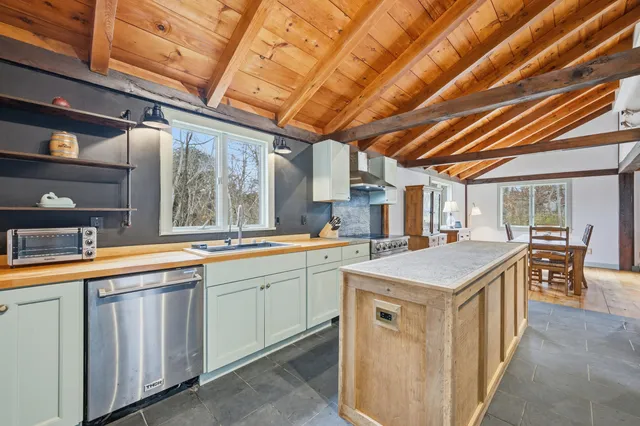 a kitchen with a stove and a sink