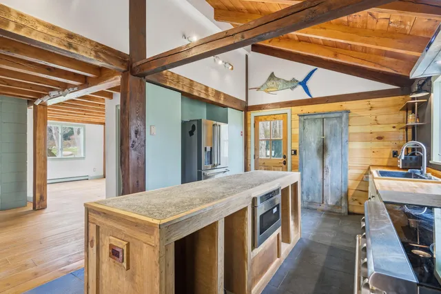 a bedroom with a large bed and a large window