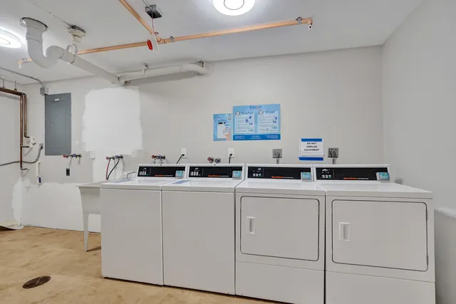 a view of cabinets stainless steel appliances furniture a refrigerator and a sink