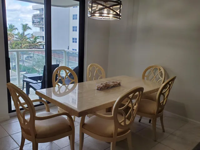 a view of a dining room that has a table and chairs