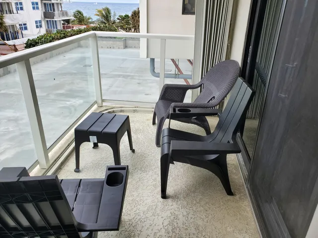 a view of balcony with wooden floor