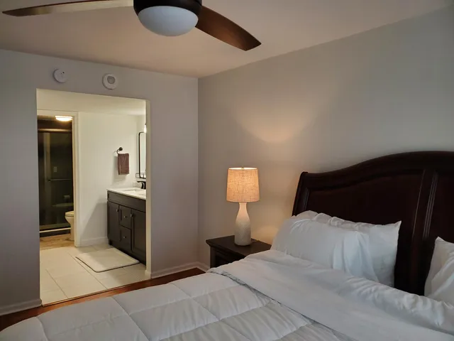 a bedroom with a bed and cabinets