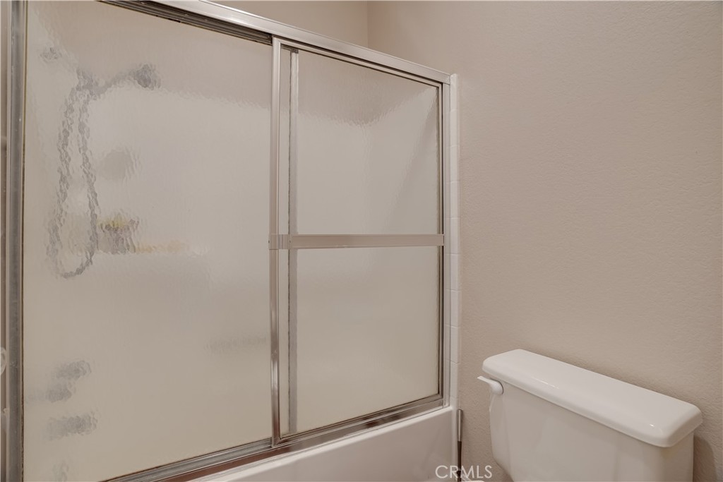 234 Gallery Tustin, CA 92782 - Photo 18 of 46 a bathroom with a shower and a toilet