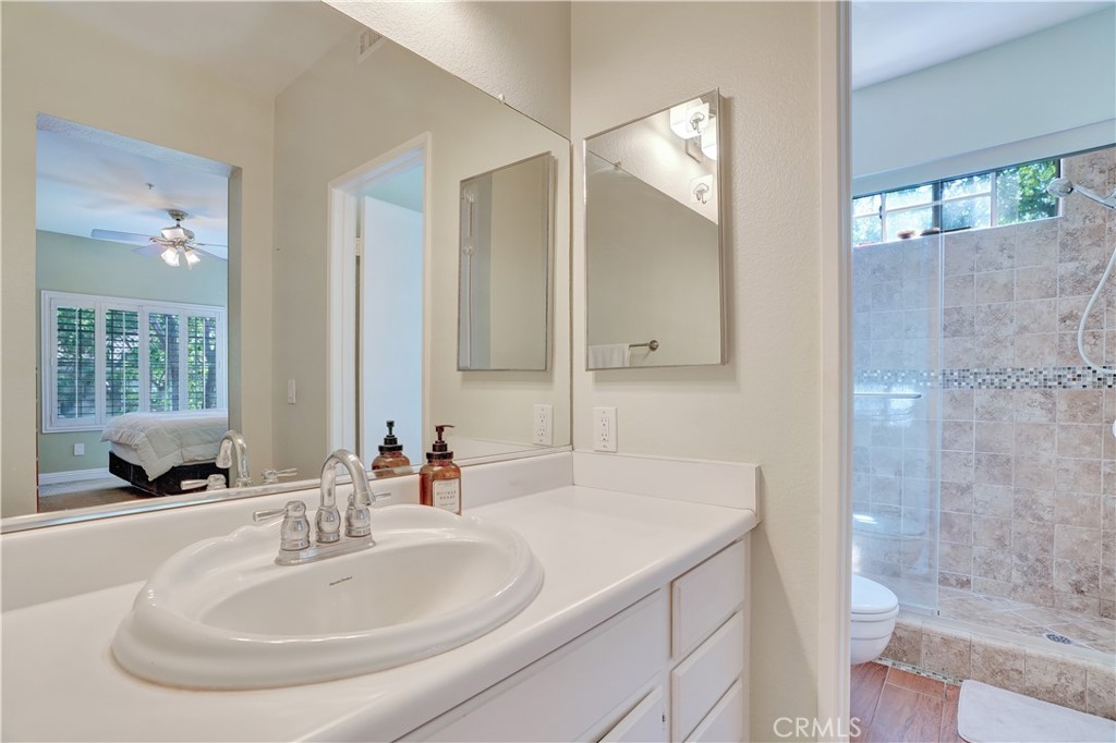 234 Gallery Tustin, CA 92782 - Photo 22 of 46 a bathroom with a sink and a mirror