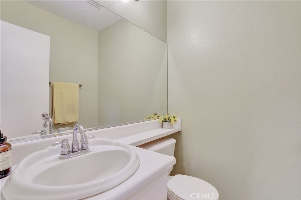 234 Gallery Tustin, CA 92782 - Photo 24 of 46 a bathroom with a sink and a toilet