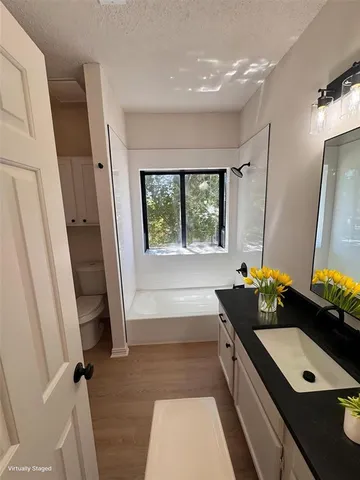 a bathroom with a double vanity sink and mirror