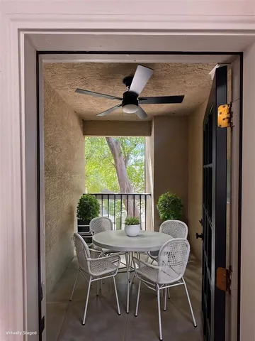 a dining room with furniture and window