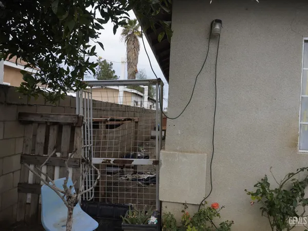 a view of house with a tree