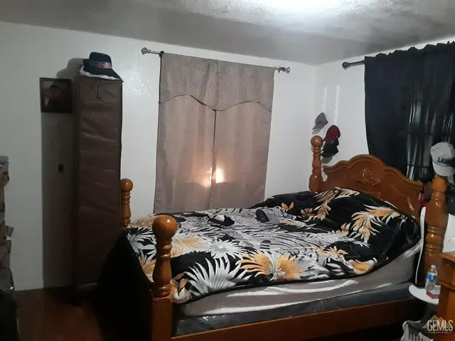 a bedroom with a bed and a closet