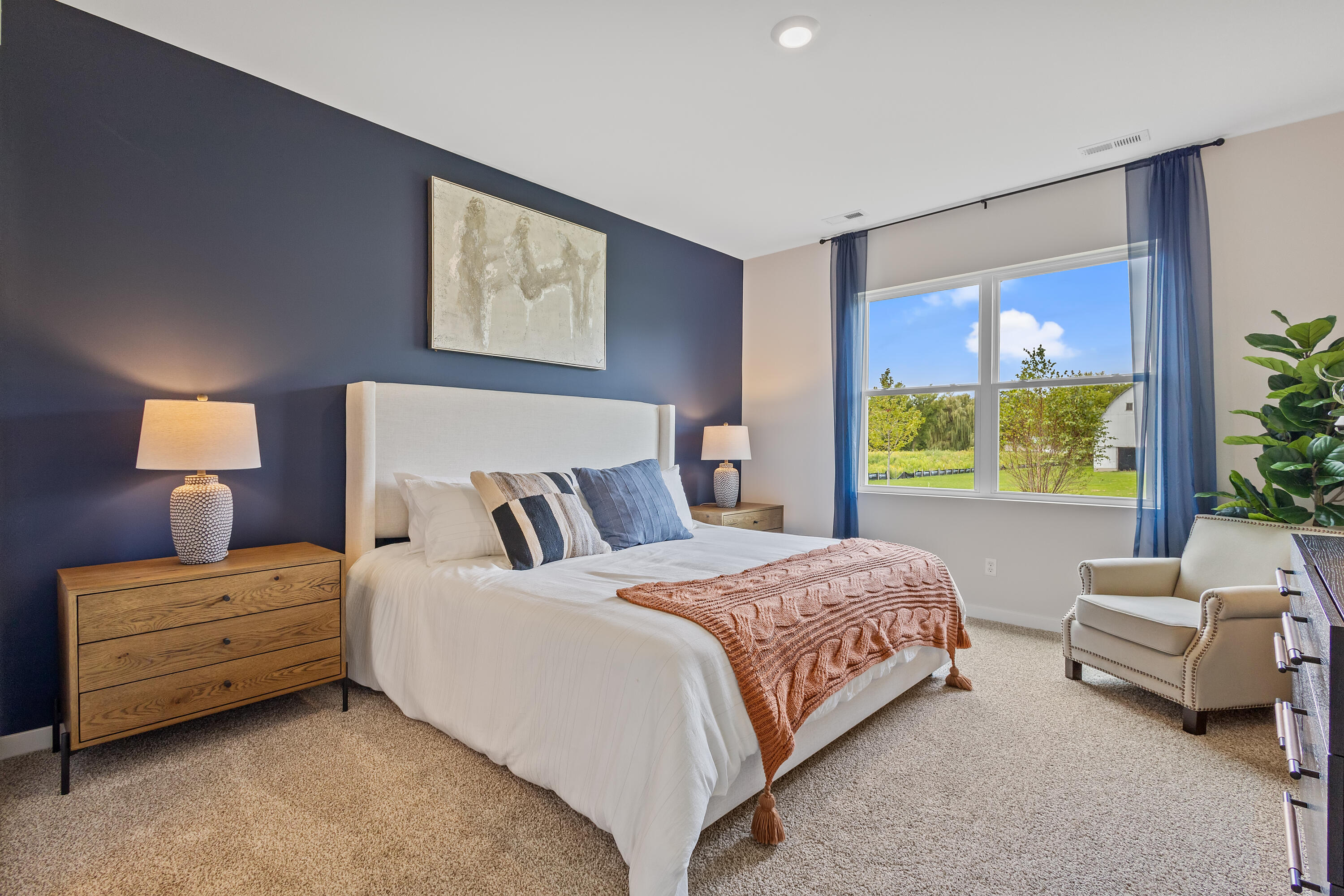 445 Bricker Street Hebron, IN 46341 - Photo 14 of 24 a bedroom with bed lamp and window