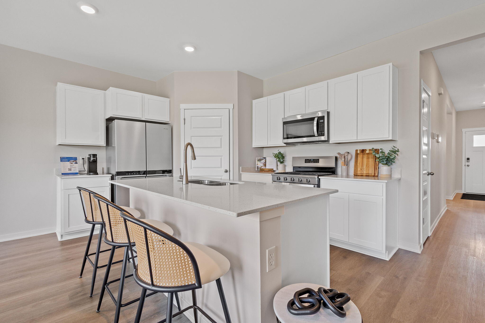 445 Bricker Street Hebron, IN 46341 - Photo 5 of 24 a kitchen with stainless steel appliances granite countertop a stove a sink a refrigerator and a microwave