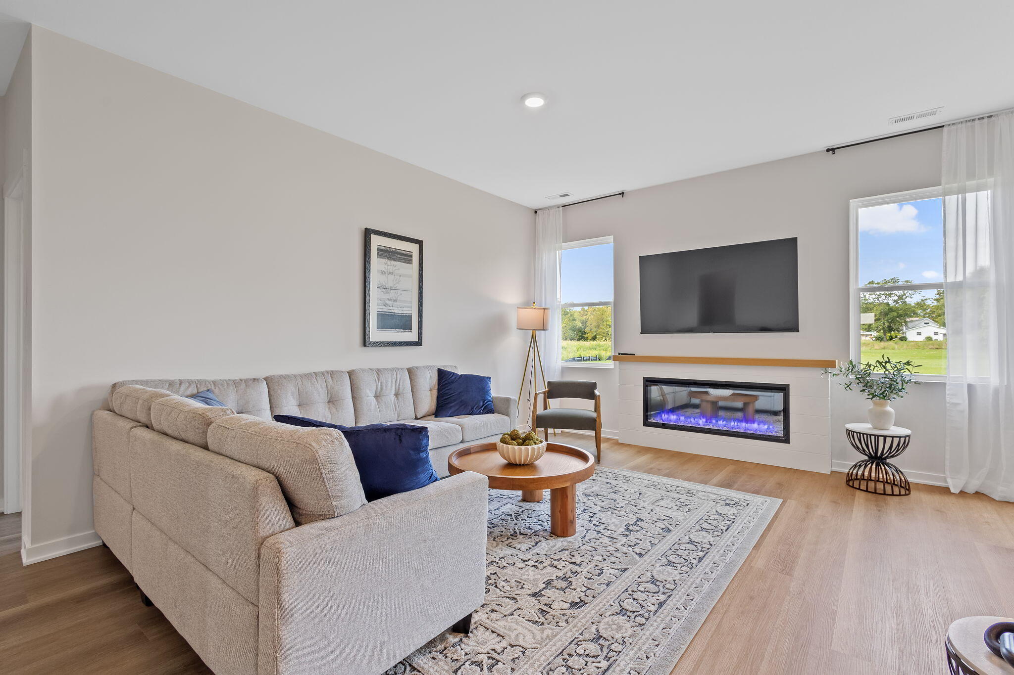 445 Bricker Street Hebron, IN 46341 - Photo 10 of 24 a living room with furniture a fireplace and a flat screen tv