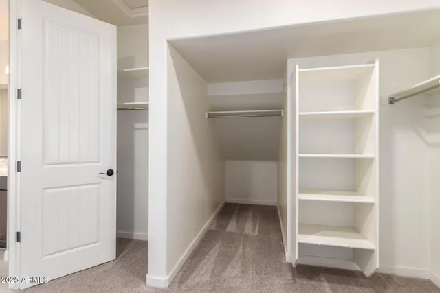 a view of an empty walk in closet