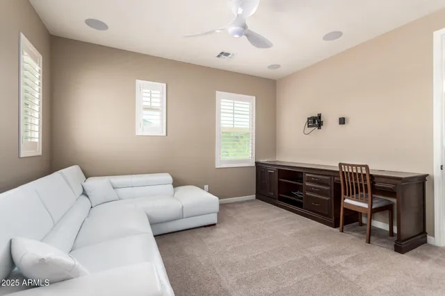 a bedroom with furniture and a window
