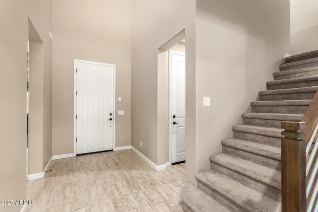 a view of entryway with wooden floor