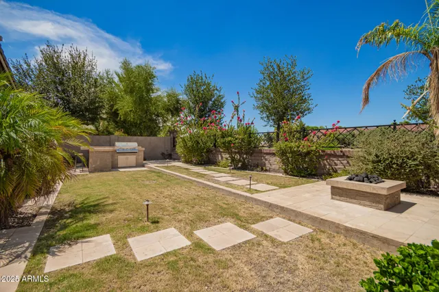 a view of a kitchen with a stove and a chair
