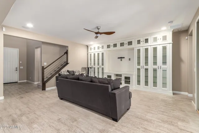 a living room with furniture and a large window