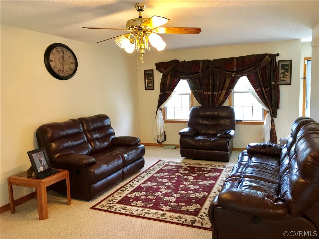 5409 Takach Road Prince George, VA 23875 - Photo 11 of 26 a living room with furniture a window and a fireplace