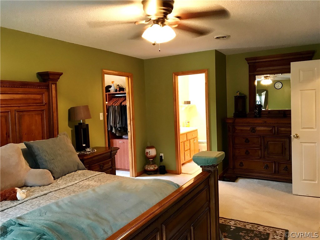 5409 Takach Road Prince George, VA 23875 - Photo 19 of 26 a bedroom with a bed and wooden furniture
