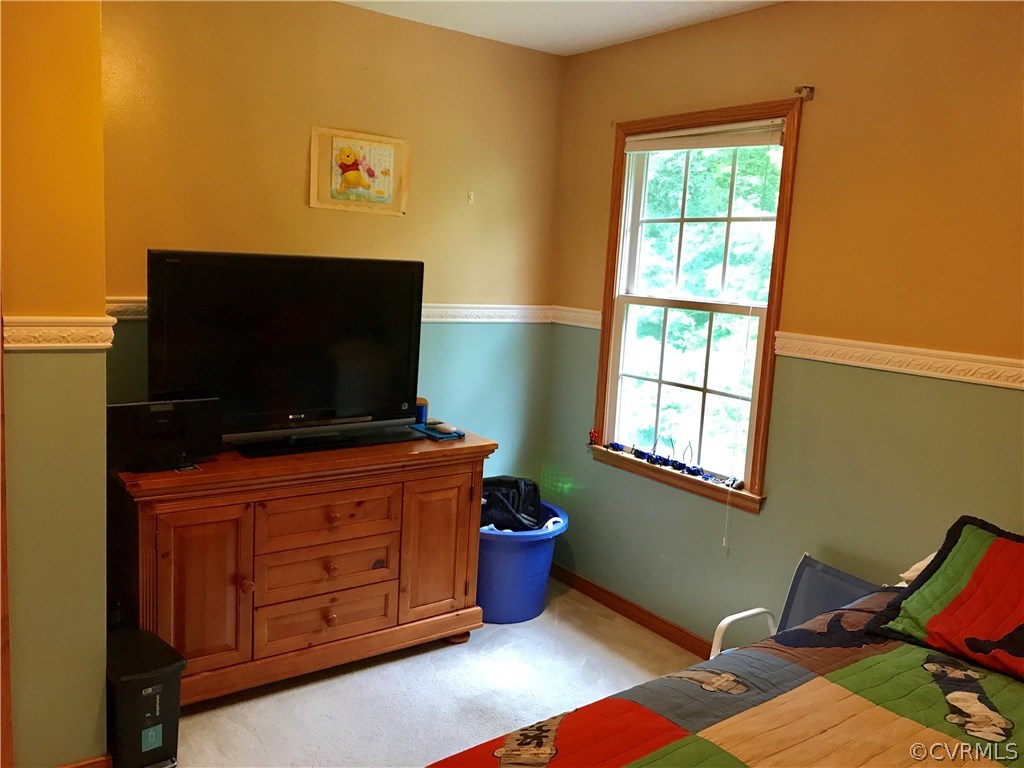 5409 Takach Road Prince George, VA 23875 - Photo 24 of 26 a living room with furniture and a flat screen tv
