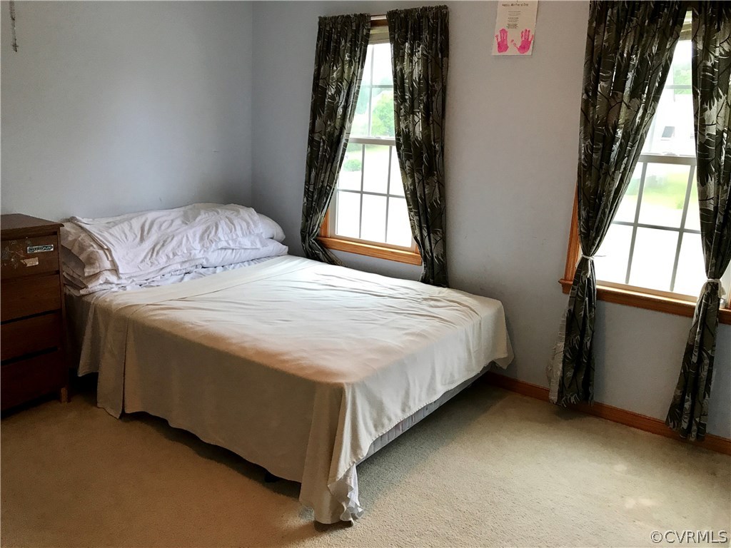 5409 Takach Road Prince George, VA 23875 - Photo 26 of 26 a spacious bedroom with a bed and a window