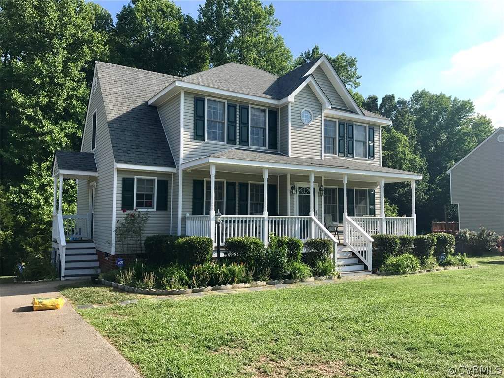 5409 Takach Road Prince George, VA 23875 - Photo 3 of 26 a front view of a house with a yard and porch