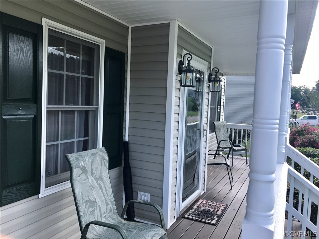 5409 Takach Road Prince George, VA 23875 - Photo 5 of 26 a balcony with table and chairs