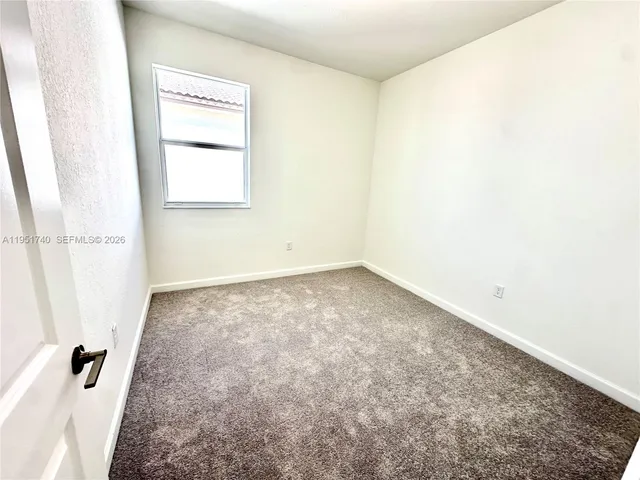 a view of a room that has a window