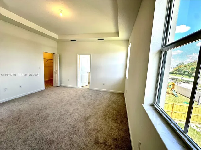 a view of hallway with natural light