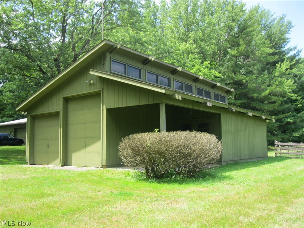 3550 Marsh Road Stow, OH 44224 - Photo 31 of 35 This large workshop/storage building has two space heaters, water and electricity, with natural light coming from the clerestory windows.