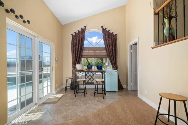 a view of a hallway with furniture and entryway