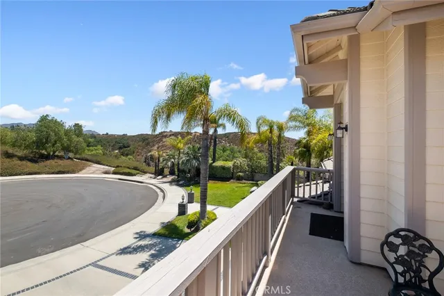 a view of balcony with furniture