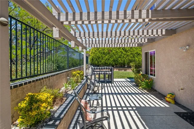 a view of balcony with wooden floor