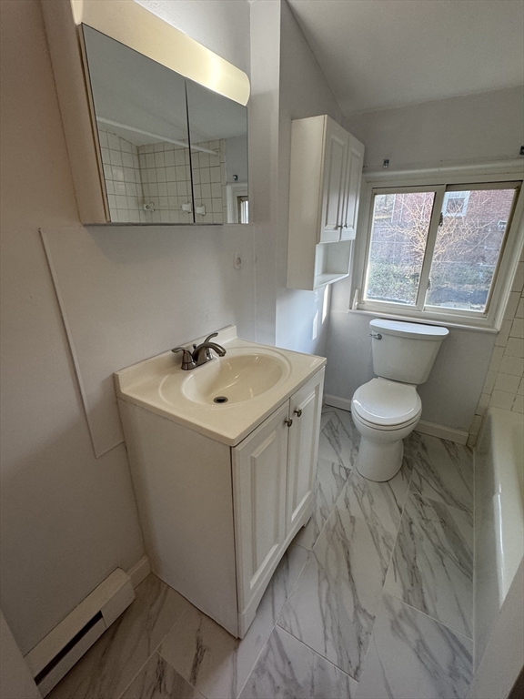 8 Glen Avenue, Unit 2 Melrose, MA 02176 - Photo 11 of 14 a bathroom with a sink toilet and mirror