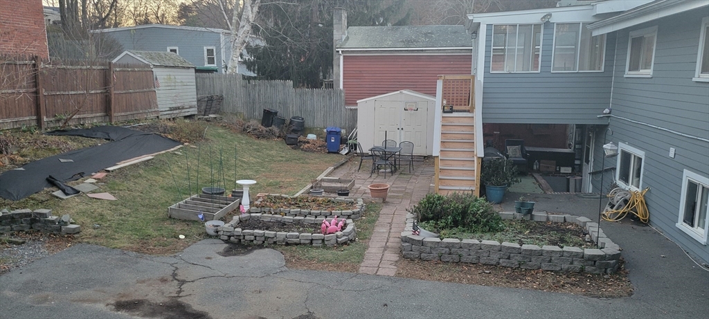 8 Glen Avenue, Unit 2 Melrose, MA 02176 - Photo 13 of 14 a view of a chairs and table in backyard