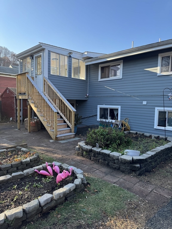 8 Glen Avenue, Unit 2 Melrose, MA 02176 - Photo 14 of 14 a front view of a house with a yard
