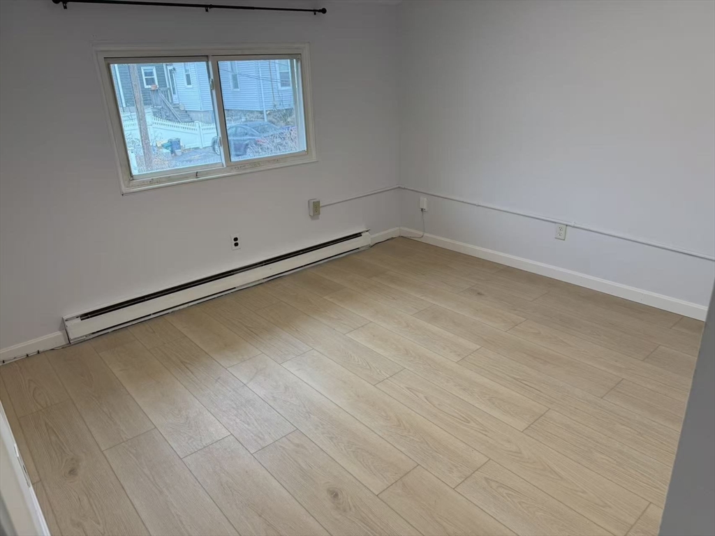 8 Glen Avenue, Unit 2 Melrose, MA 02176 - Photo 5 of 14 a view of a room with wooden floor