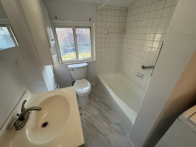 a bathroom with a sink and a tub